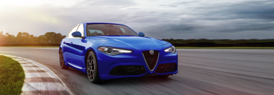 2022 Alfa Romeo Giulia driving down a winding road