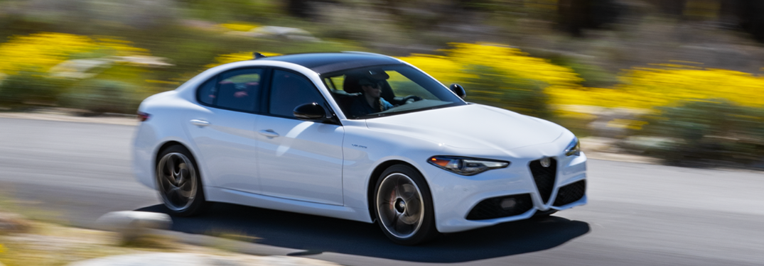 2023 Alfa Romeo Giulia driving down a rural road