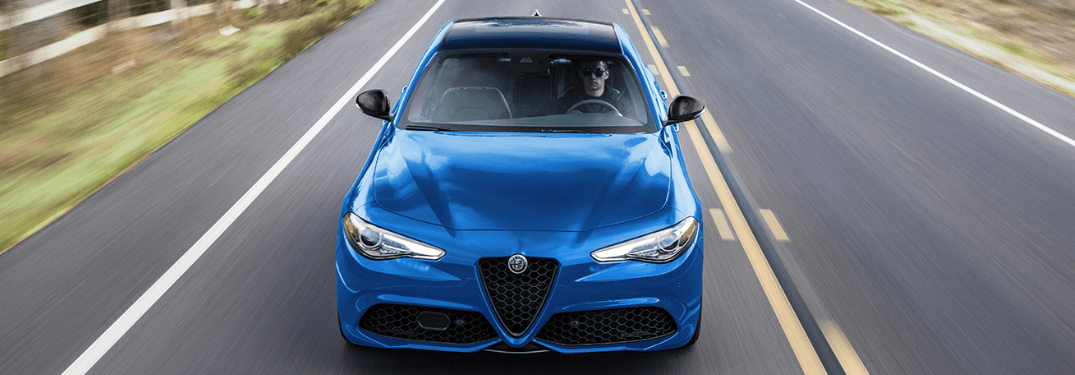 2023 Alfa Romeo Giulia driving down a rural road