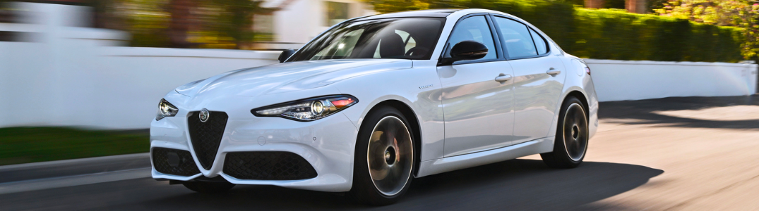 2023 Alfa Romeo Giulia driving down a city street