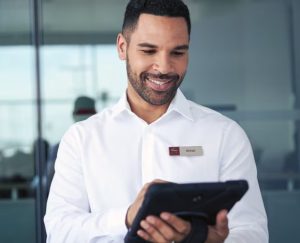 a-nissan-customer-service-employee-with-a-tablet
