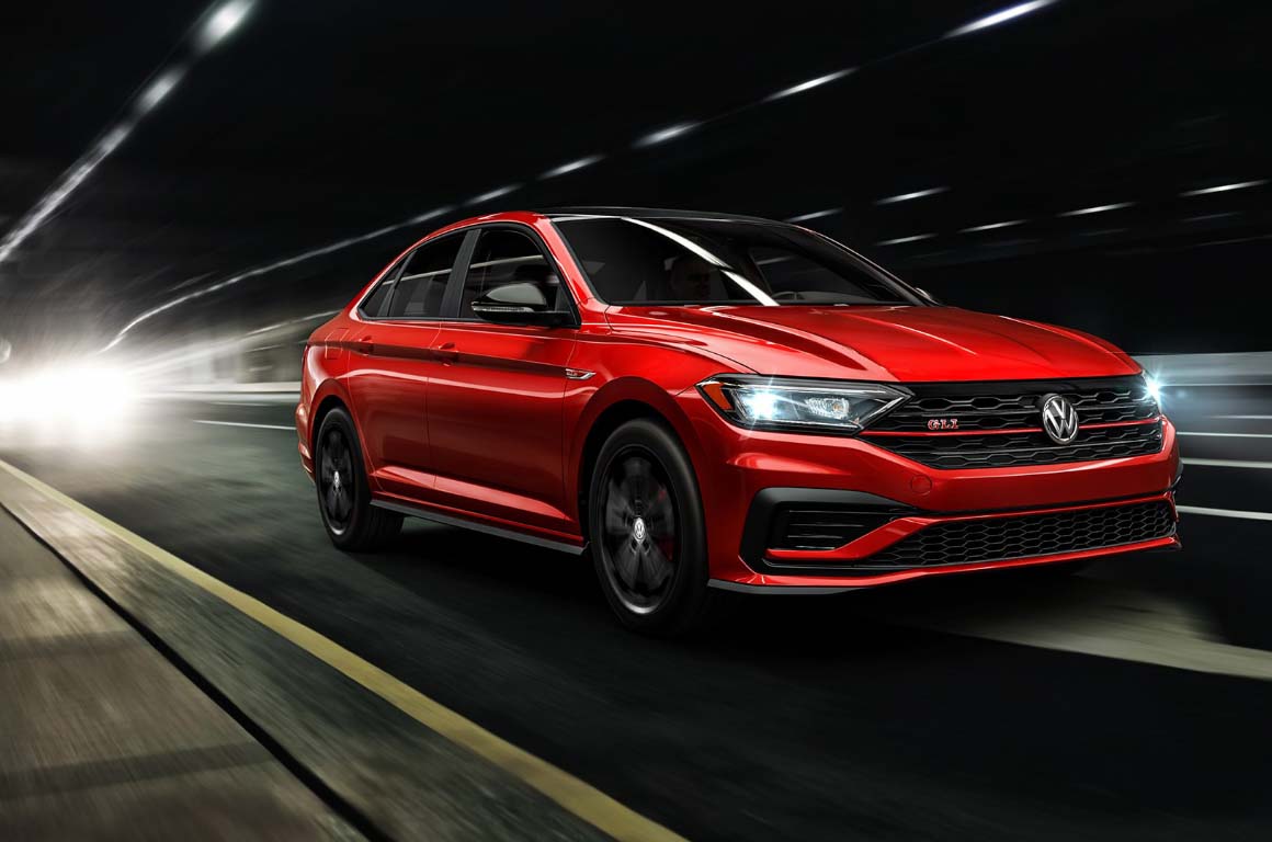 Red Sedan VW driving down tunnel