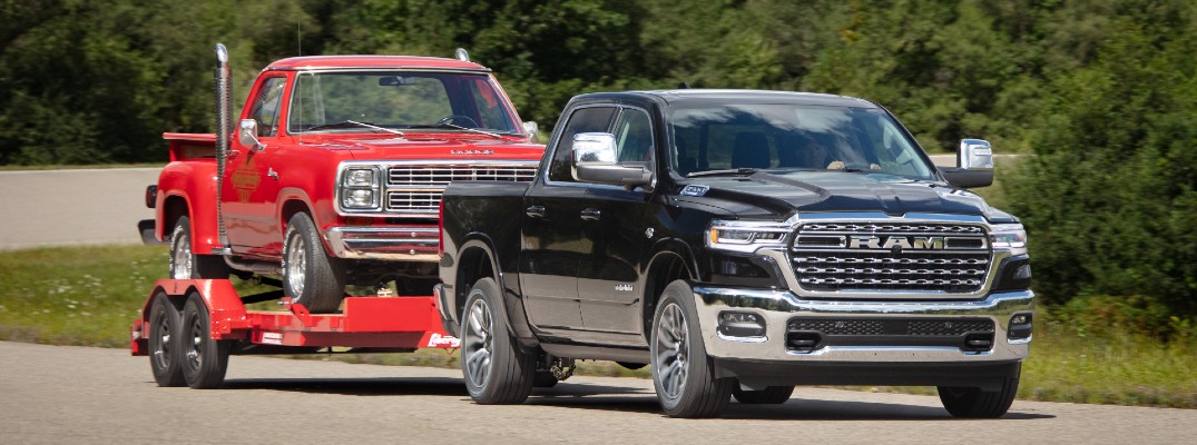 A photo of the 2026 Ram 1500 towing another truck.
