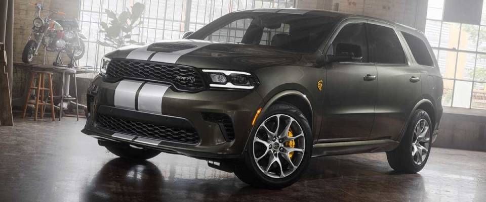 A green 2026 Dodge Durango with white stripes on the hood. New 2026 Dodge Durango interior cabin guide at Blenheim Chrysler Dodge Jeep Ram in Blenheim, ON
