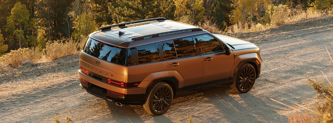 The 2026 Santa Fe driving on a rural road