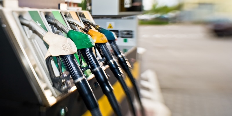 Closeup of fuel pumps at a gas station.