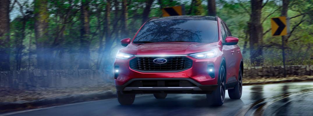Ford Escape driving with headlights on