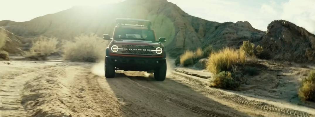 26 bronco driving on road