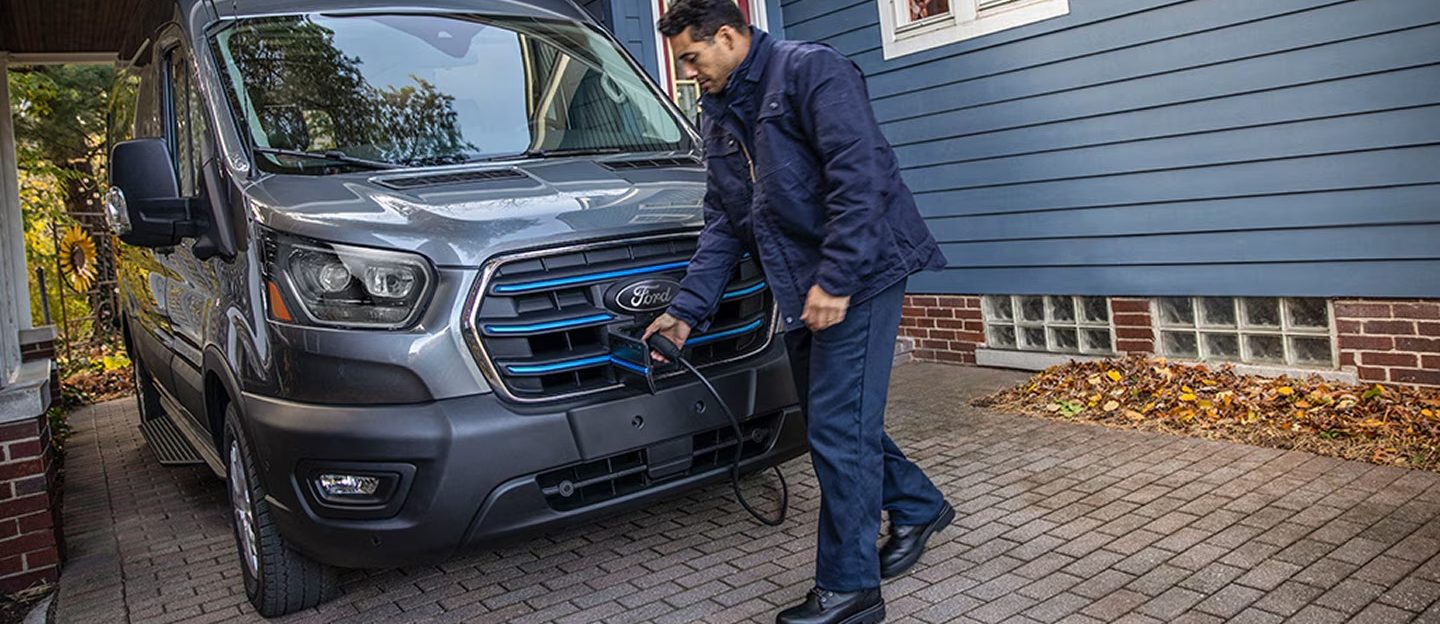 Unknown person unplugging charger from 2026 Ford E-Transit