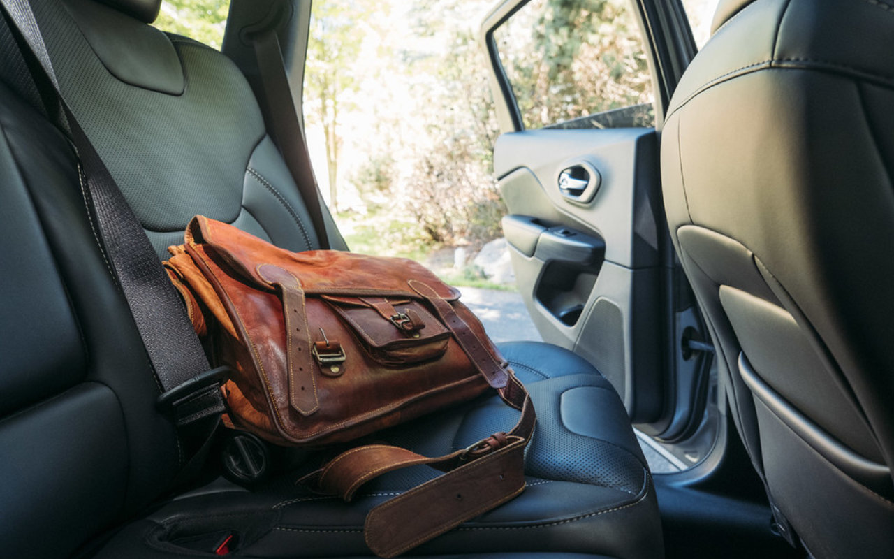 view of a brown leather bag on the backseat of a 2023 Jeep Cherokee