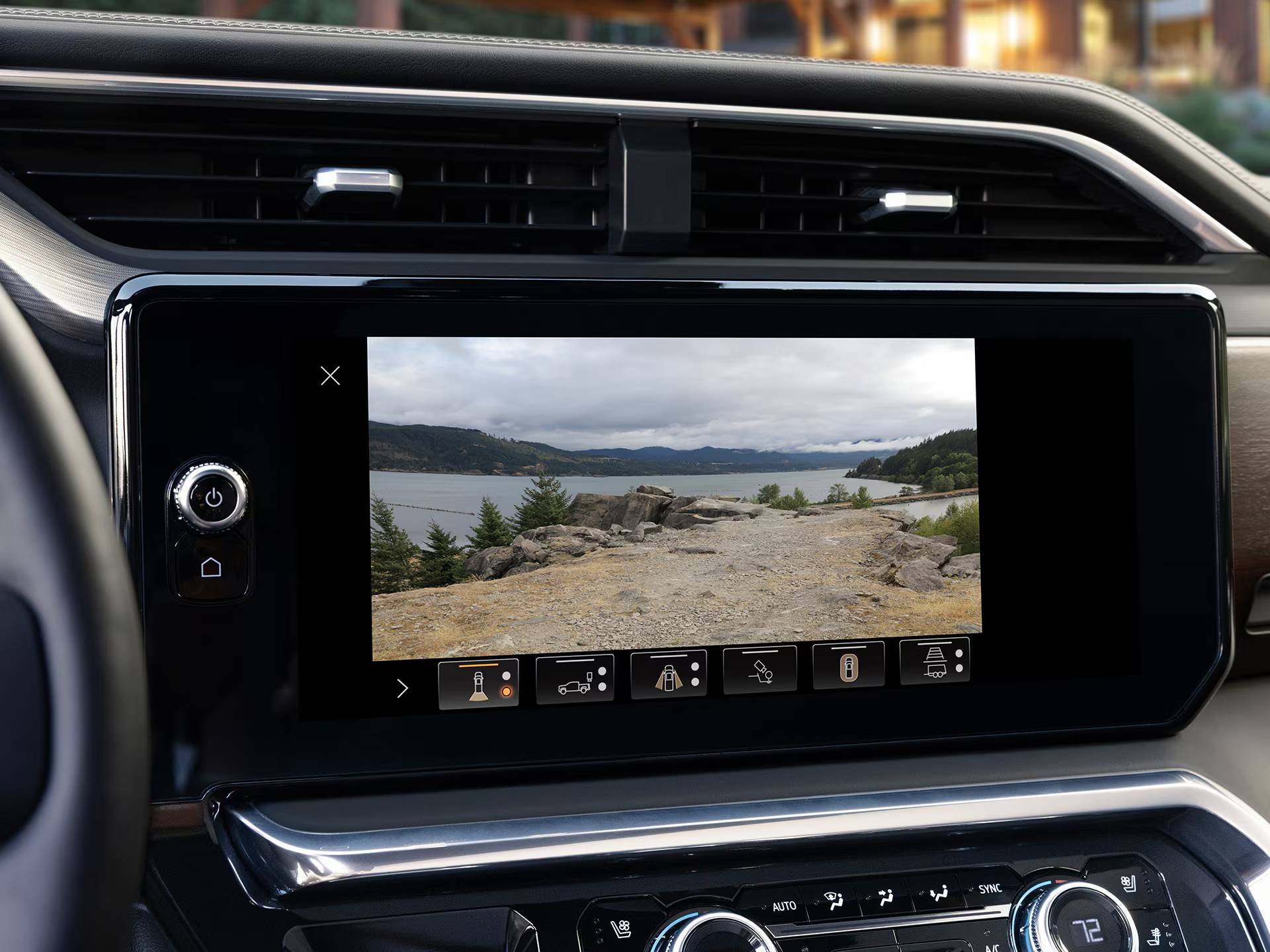 A closeup of the dashboard screen of a 2026 GMC Sierra 1500, showing off a camera view displaying the truck's surroundings