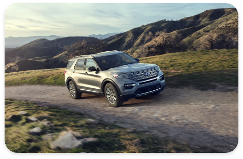 2021_silver_ford_explorer_suv_driving_on_mountain_roads