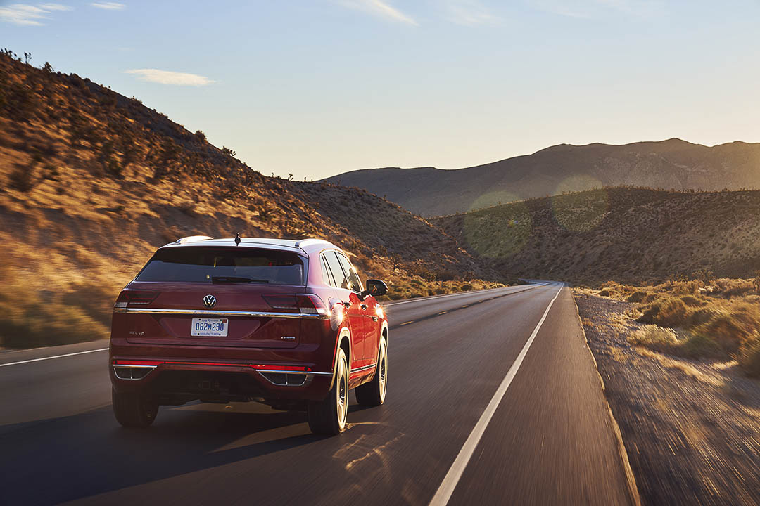 rear view of the 2021 VW Atlas Cross Sport driving down a road