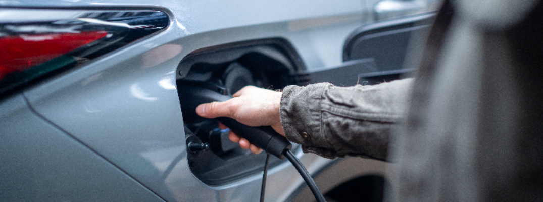 Person Charging 2026 Mitsubishi Outlander PHEV