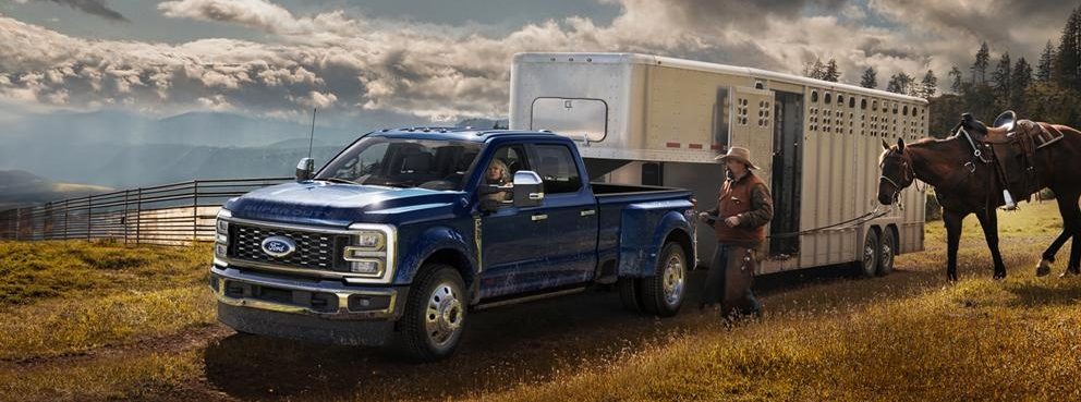 2026 Ford Super Duty towing a trailer with horse