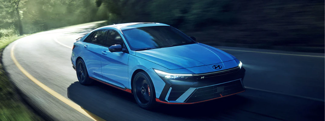 2026 Hyundai Elantra N driving down a back road