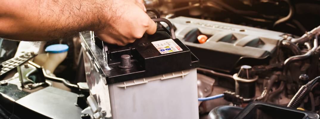 Tech installing battery