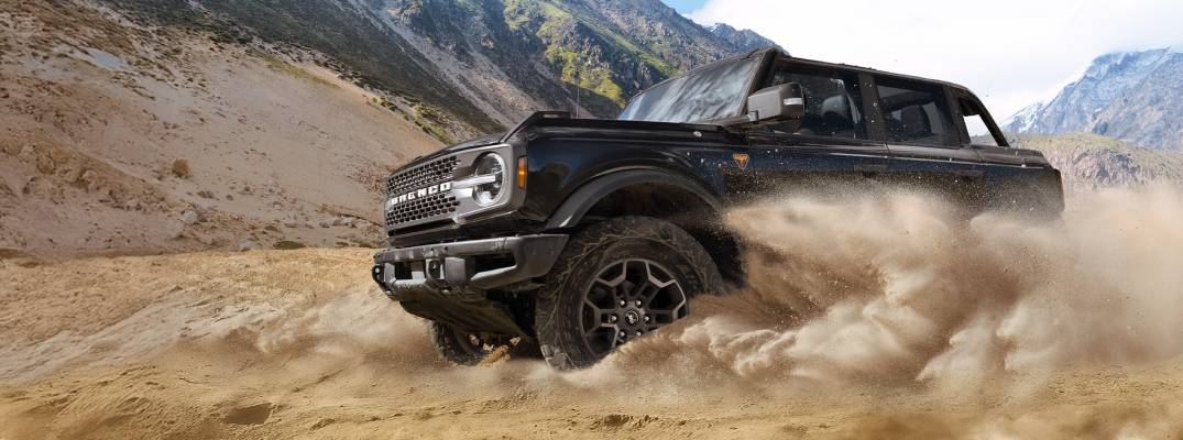 2026 Ford Bronco driving through dirt terrain
