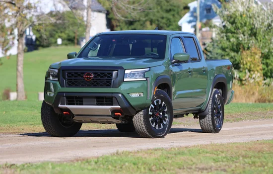Green Nissan Frontier pickup parked outdoors, highlighting rugged design and everyday reliability as the Nissan Frontier - Simple, Tough and Budget-Friendly at Driven Auto Group Newmarket.