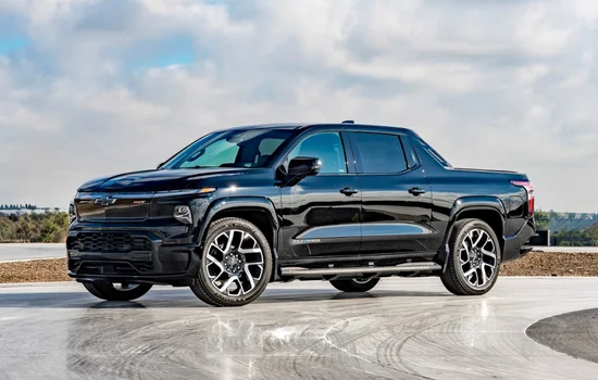 Black Chevrolet Silverado 1500 pickup truck parked outdoors, showcasing rugged strength and capability at Driven Auto Group Newmarket.
