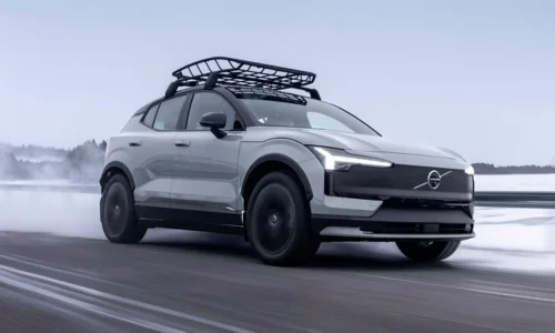 2026 Volvo EX30 electric SUV driving on a snowy road, featured by DRIVEN Newmarket as a winter-ready EV for Canadian drivers.