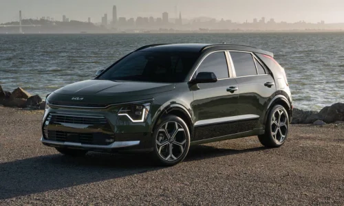 2026 Kia Niro EV electric crossover parked by the waterfront, featured by DRIVEN Newmarket as a practical and efficient EV for Canadian drivers.