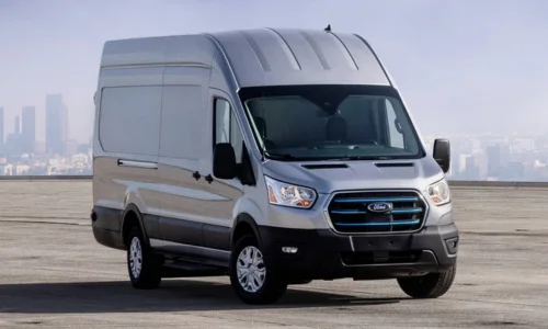 2026 Ford E-Transit electric cargo van parked in an open urban area, featured by DRIVEN Newmarket as a commercial EV solution.
