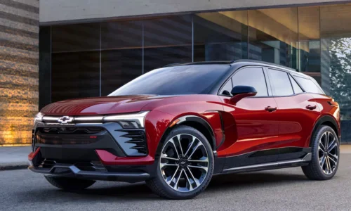2026 Chevrolet Blazer EV in red parked outside a modern building, featured by DRIVEN Newmarket as a bold all-electric SUV option.