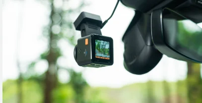 Vantrue E1 Pro compact dash cam mounted on a windshield recording live road footage, featured by DRIVEN Newmarket for reliable vehicle security.