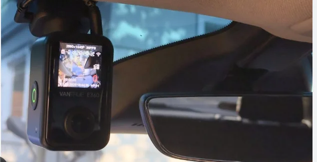 Vantrue E360 dash cam mounted near the rearview mirror recording interior and exterior footage, featured by DRIVEN Newmarket for full-coverage vehicle security.