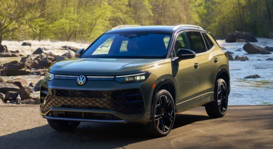 2026 Volkswagen Tiguan SUV parked near a scenic river with trees in the background, featured by DRIVEN Newmarket as a stylish and practical compact SUV.