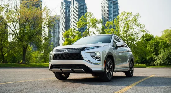 2026 Mitsubishi Eclipse Cross SUV parked in a city setting with skyline in the background, featured by DRIVEN Newmarket as a modern compact SUV.