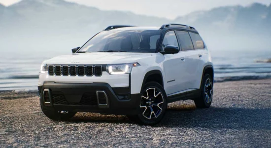 2026 Jeep Cherokee SUV parked by the waterfront with mountains in the background, featured by DRIVEN Newmarket as a rugged and capable SUV.