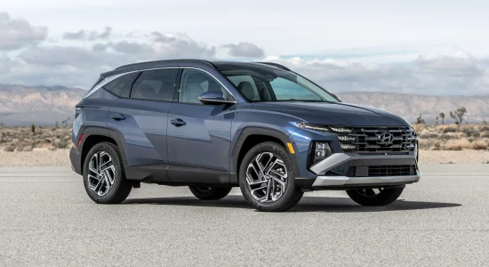 2026 Hyundai Tucson SUV parked on an open road with scenic mountains in the background, featured by DRIVEN Newmarket as a stylish and versatile compact SUV.