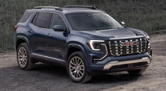 2026 GMC Terrain SUV in blue parked on a gravel road, featured by DRIVEN Newmarket as a refined and capable compact SUV.