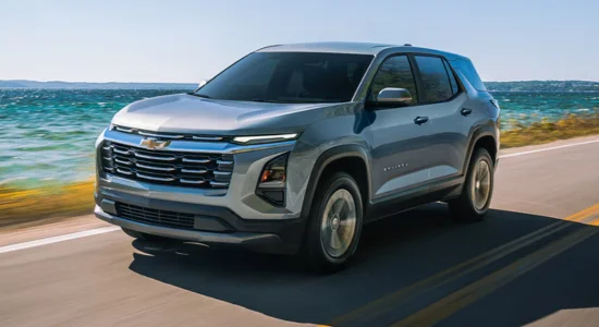 2026 Chevrolet Equinox SUV driving along a coastal highway, featured by DRIVEN Newmarket as a versatile and family-friendly SUV.