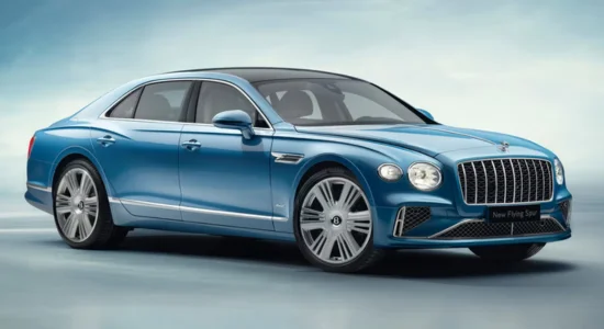 2026 Bentley Flying Spur Hybrid luxury sedan in blue displayed in a studio setting, featured by DRIVEN Newmarket as a premium hybrid performance vehicle.