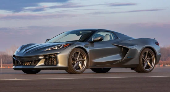 2026 Chevrolet Corvette E-Ray hybrid sports car parked on an open road at sunset, featured by DRIVEN Newmarket as a high-performance electrified supercar.