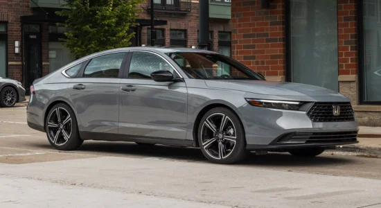2026 Honda Accord sedan parked on a city street, featured by DRIVEN Newmarket as a stylish and fuel-efficient midsize sedan for Canadian drivers.