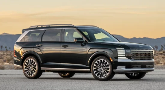 2026 Hyundai Palisade Hybrid SUV parked on an open road with mountains in the background, featured by DRIVEN Newmarket as a spacious hybrid family SUV.