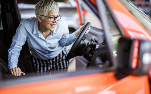 Customer checking the interior and dashboard of a vehicle during an Interior Inspection at DRIVEN Newmarket.