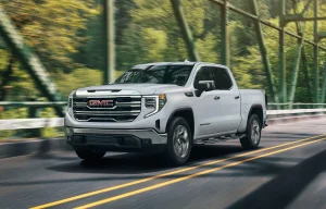 2026 GMC Sierra 1500 driving down bridge