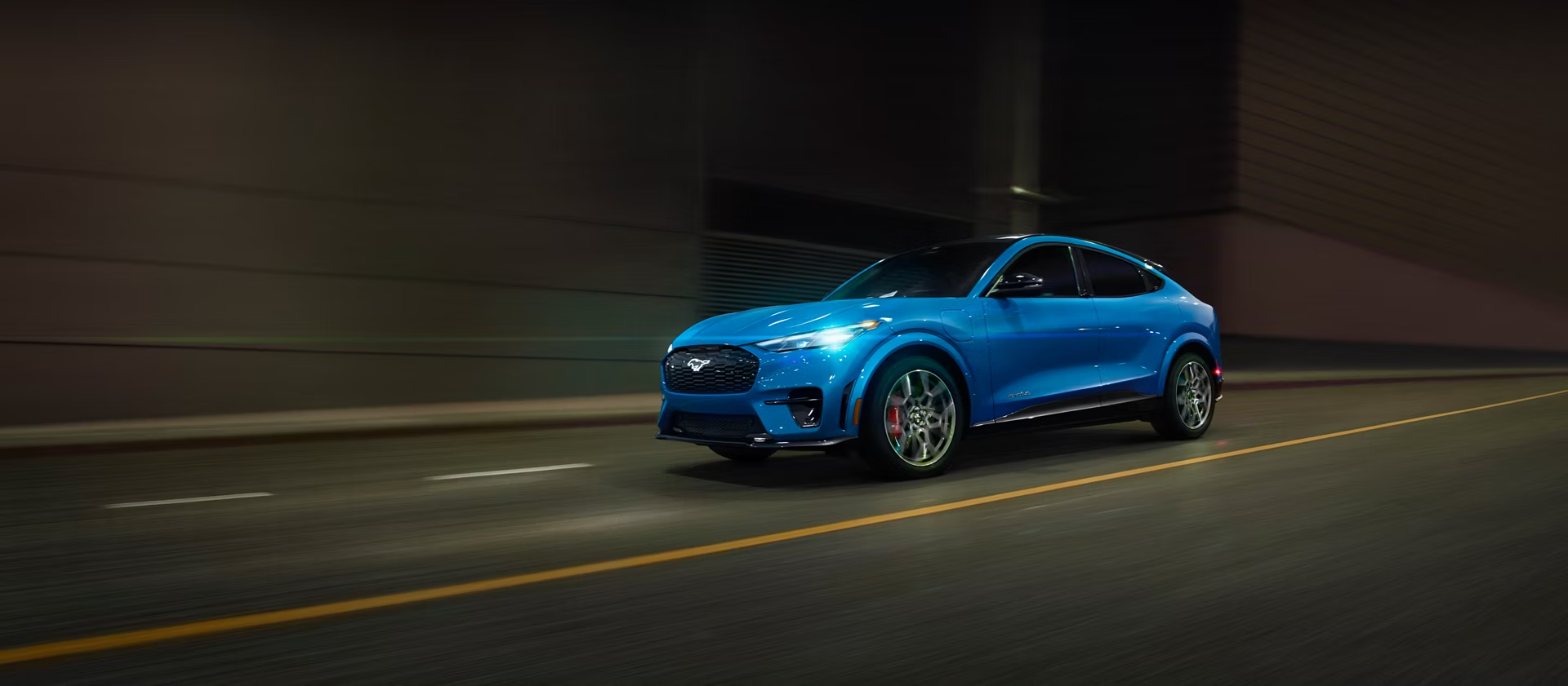2026 Ford Mustang Mach-E driving down road