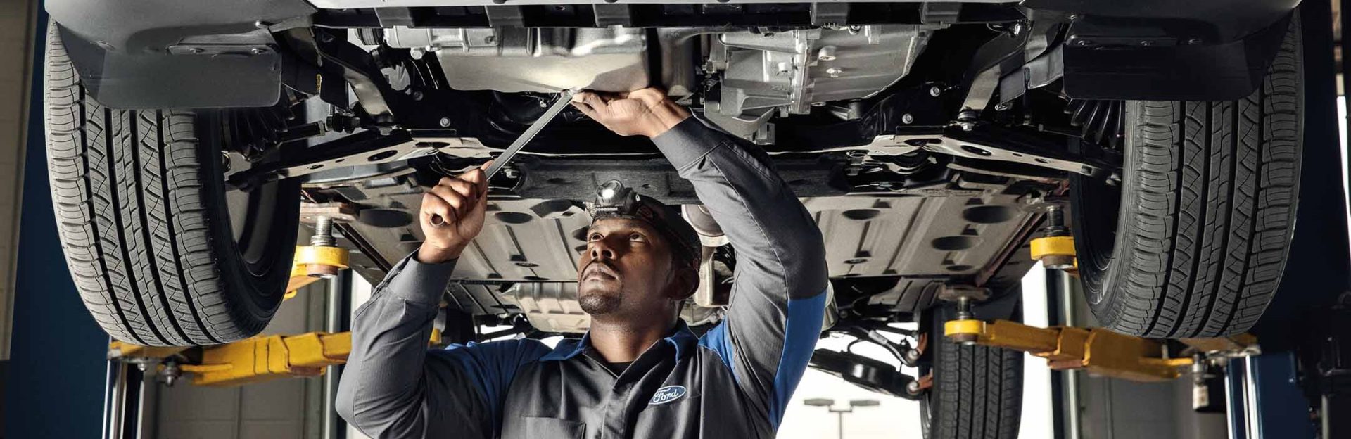 Tech working on vehicle