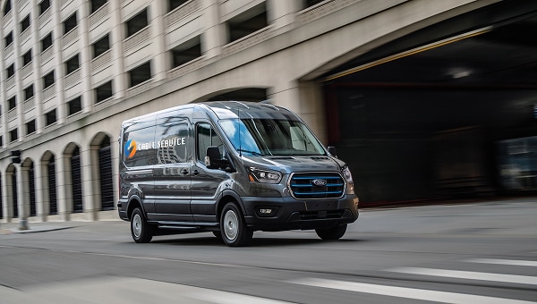 2026 Ford E-Transit driving down the street