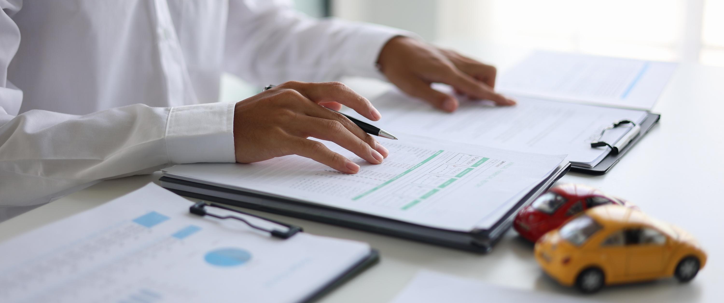 Unknown person looking over documents
