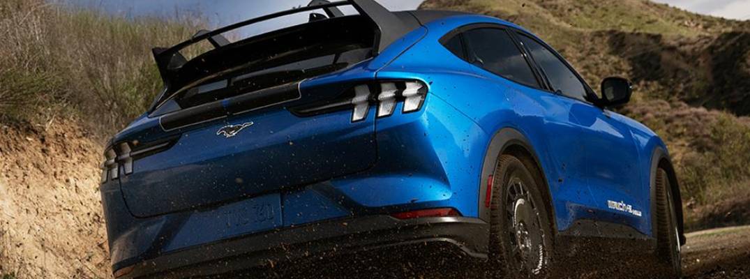2026 Mustang Mach-E driving through dirt terrain