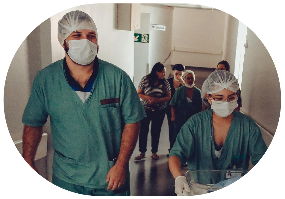 group of nurses walking down a hallway