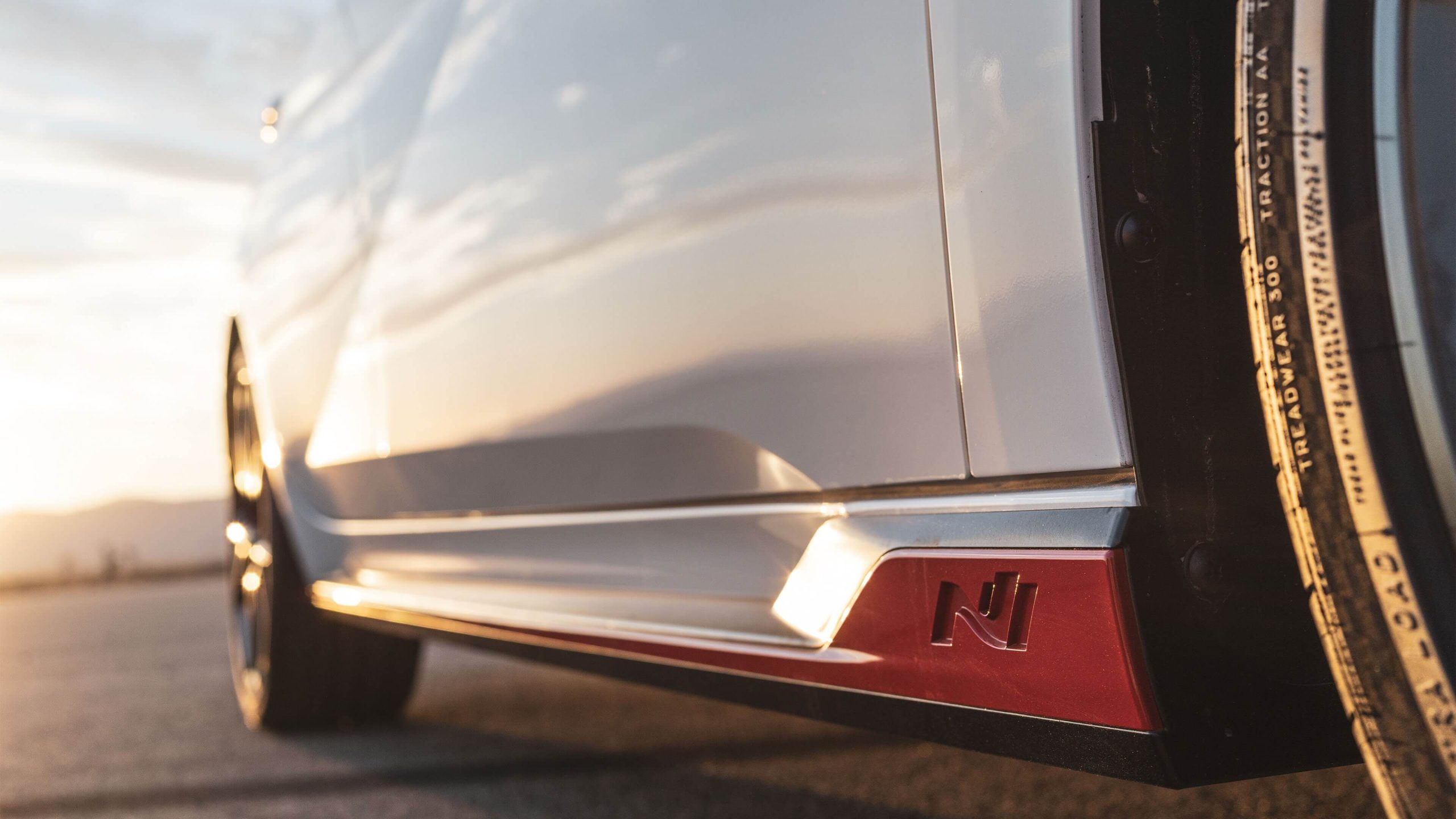 N logo engraved side moulding with red accents 