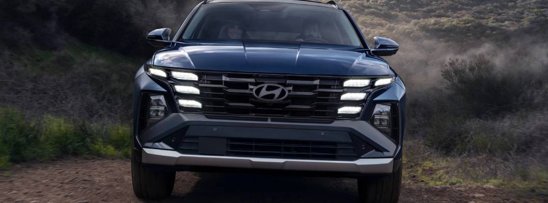 2026 Hyundai Santa Fe driving up dirt road